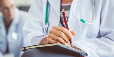 Stock photo of medical professional with a notebook