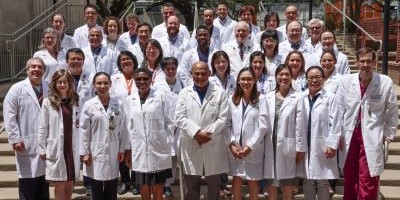 Group photo of physicians in white coats